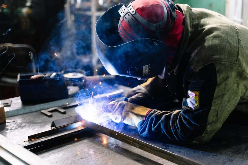 welding arm guard hands on metal